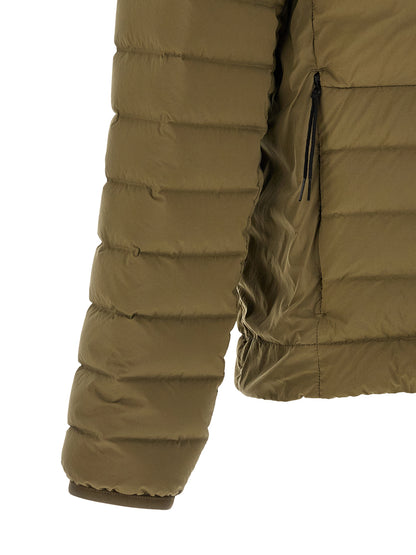 This Hooded Puffer Jacket by Stone Island for men in polyamide & goose-down bicolour & green exhibits a edgy silhouette, meticulously detailed with functional lightweight, pockets, hooded & insulated and a edgy hooded high-neck neckline for a edgy finish.