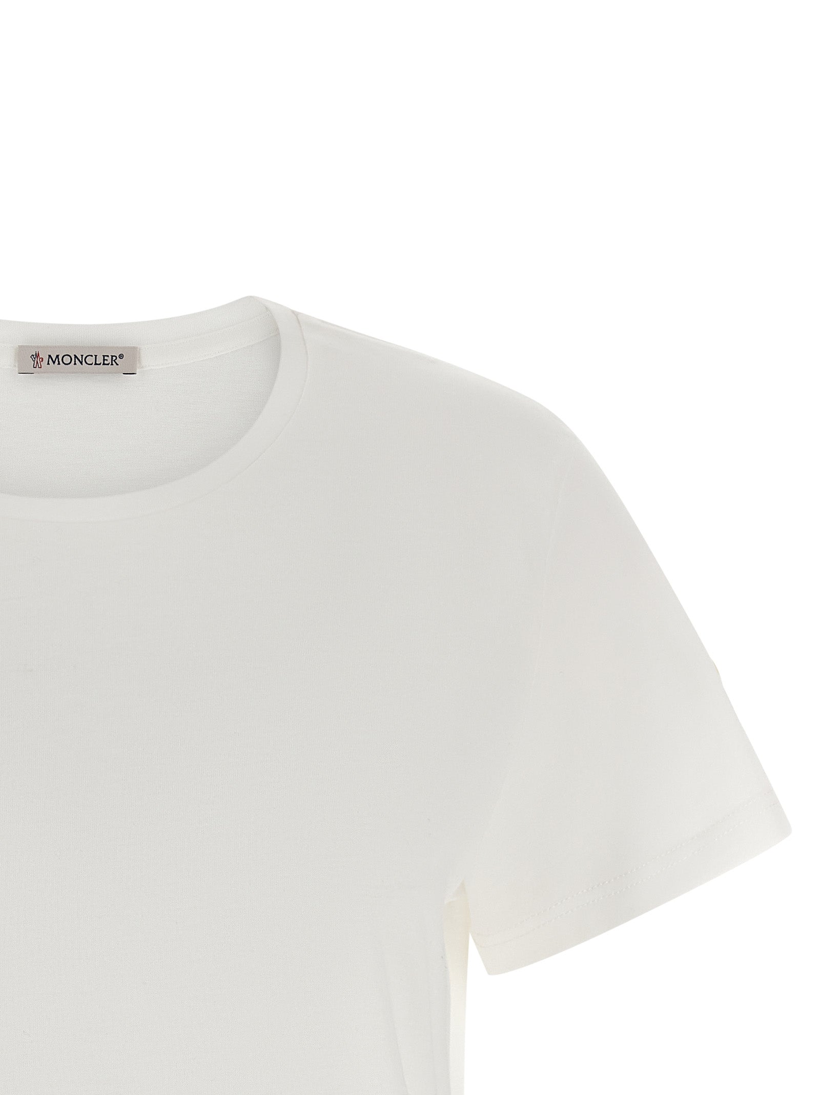 T-Shirt by Moncler for women in cotton felt white showcases a fashionable silhouette, elegantly detailed with a fashionable and for a sophisticated, high-fashion look.