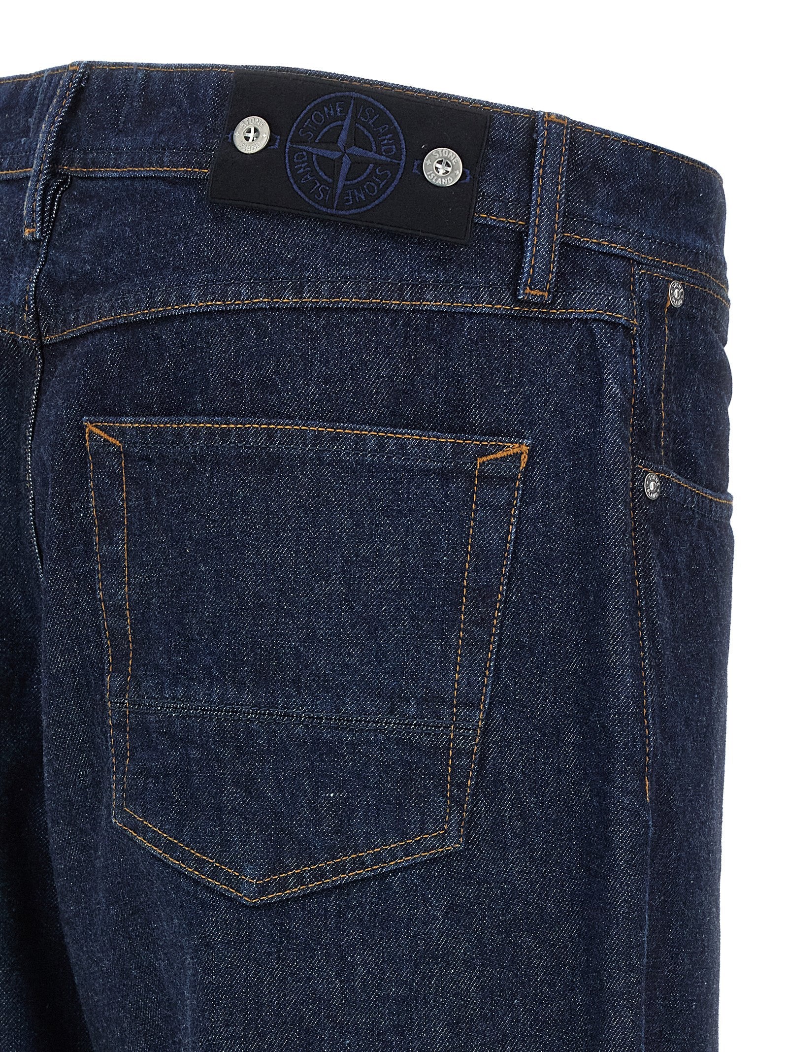 Jeans by Stone Island for men in denim cotton blue & indigo presents a tailored silhouette, showcasing a tailored straight-leg, relaxed-fit & wide and long cut with a refined for a truly tailored aesthetic.