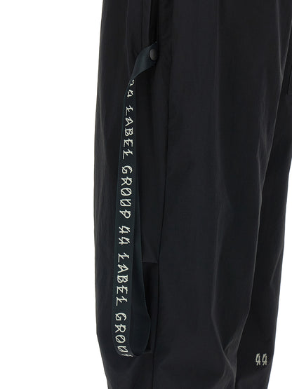 Activewear Pants by 44 Label Group for men in stretch nylon black & print features an streamlined design with , highlighting a streamlined straight-leg, athletic & wide and long cut with a comfortable .
