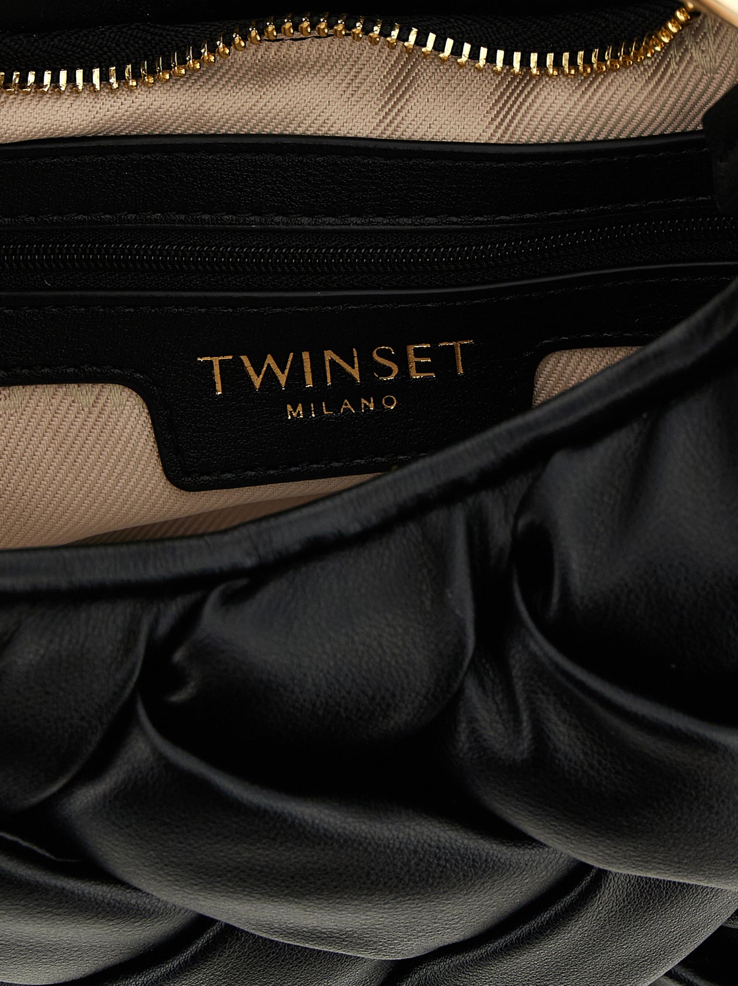 Sling Handbag by Twinset for women in polyethylene & polyurethane black presents a ornamental silhouette, showcasing a secure zipper, ample , and versatile shoulder-strap & handle for a ornamental finish.