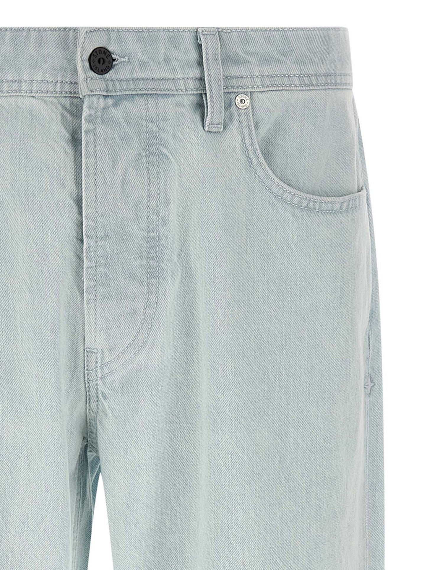 Jeans by Stone Island for men in organic cotton denim indigo & light-blue features an sartorial straight-leg & wide and long with a cut for a sartorial finish.