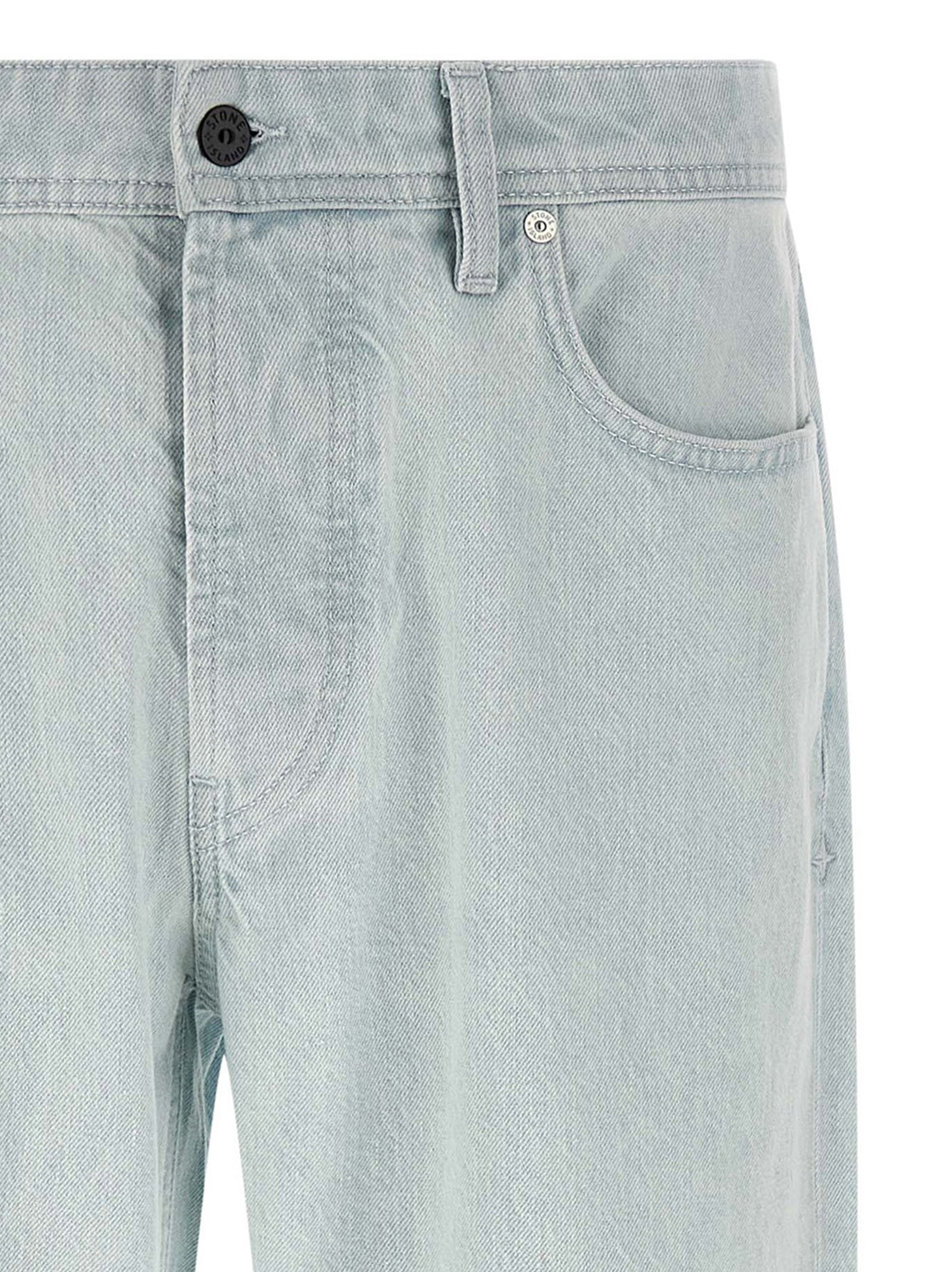 Jeans by Stone Island for men in organic cotton denim indigo & light-blue features an sartorial straight-leg & wide and long with a cut for a sartorial finish.