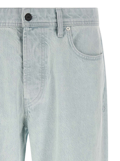 Jeans by Stone Island for men in organic cotton denim indigo & light-blue features an sartorial straight-leg & wide and long with a cut for a sartorial finish.