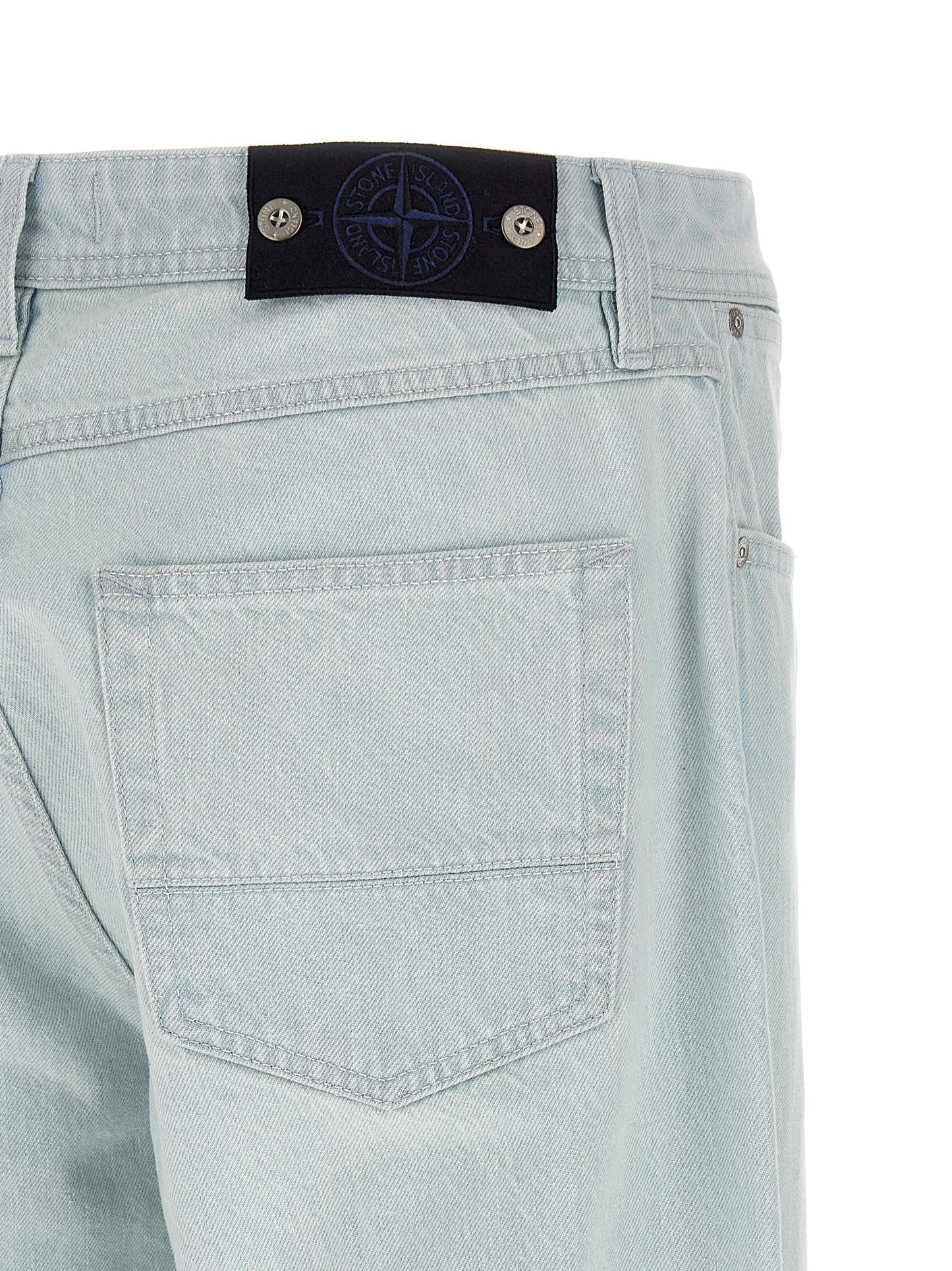 Jeans by Stone Island for men in organic cotton denim indigo & light-blue presents a tailored silhouette, showcasing a tailored straight-leg & wide and long cut with a refined for a truly tailored aesthetic.