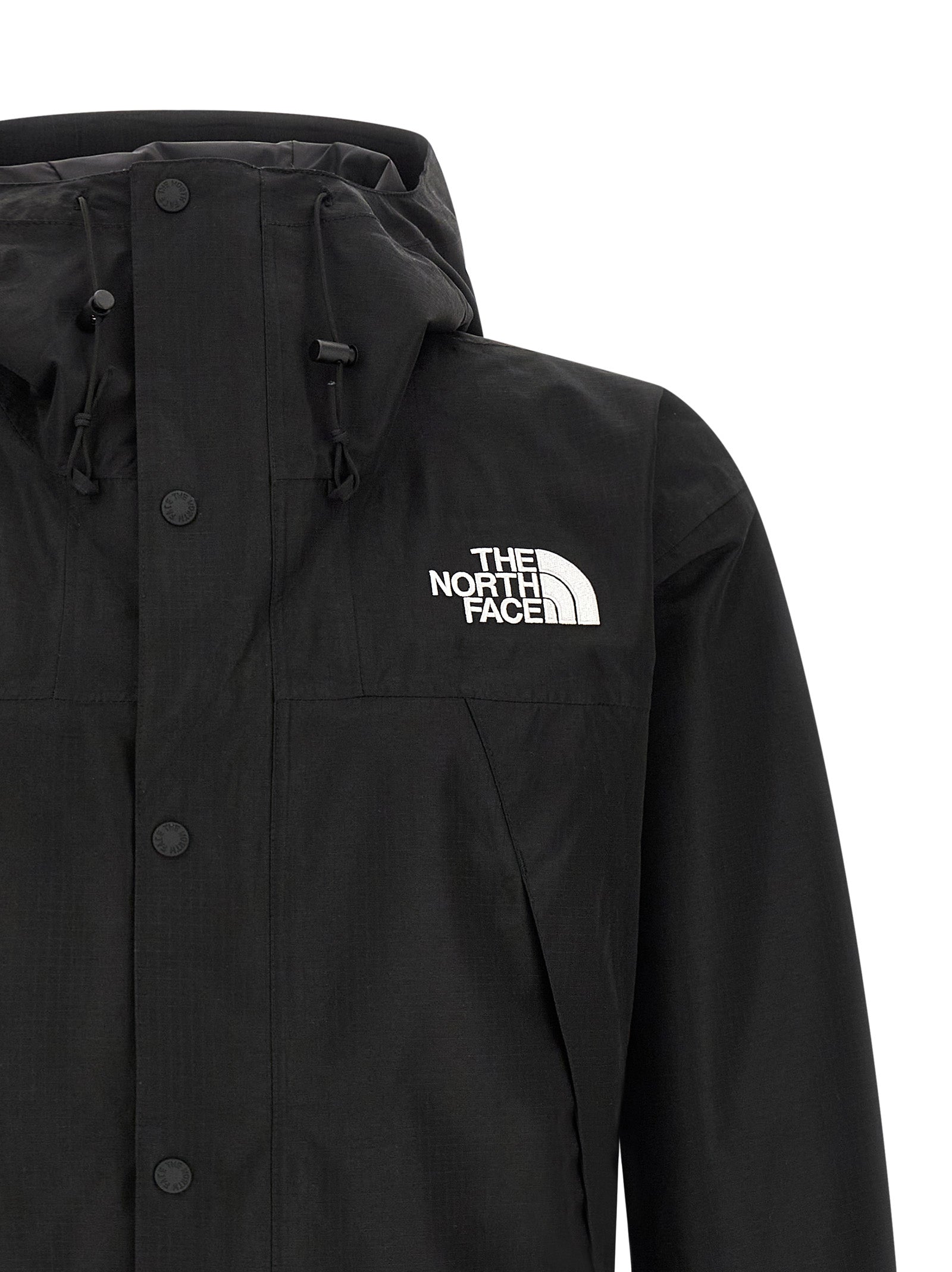 Hooded Windbreaker Jacket by The North Face for men in polyester black showcases a urban chic silhouette, detailed with a urban chic hooded neckline and functional water-resistant, pockets, hooded & windproof for a polished finish.