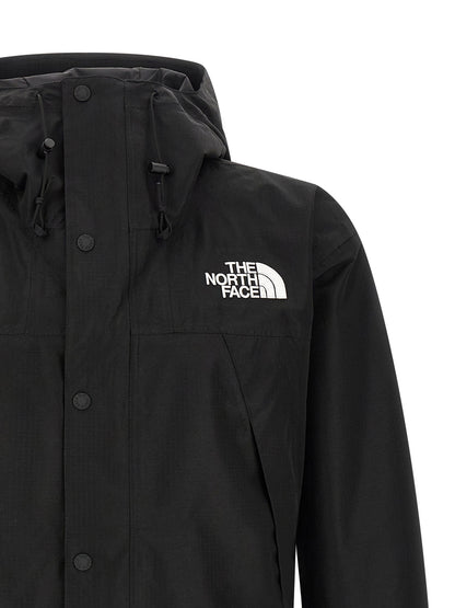 Hooded Windbreaker Jacket by The North Face for men in polyester black showcases a urban chic silhouette, detailed with a urban chic hooded neckline and functional water-resistant, pockets, hooded & windproof for a polished finish.
