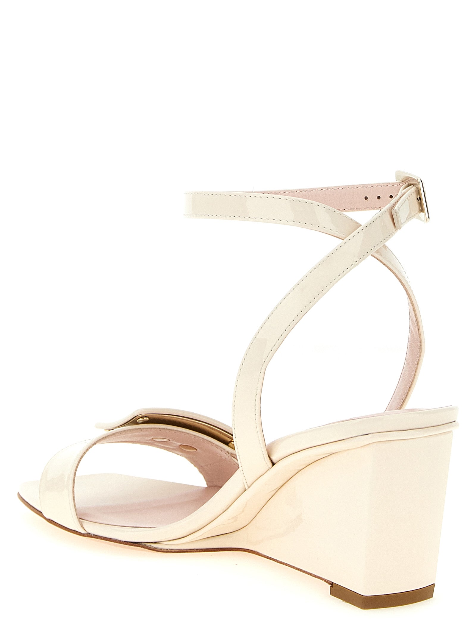 Wedge Ankle Strap Sandals by Roger Vivier for women in patent calfskin leather white & signature features an exquisite silhouette, showcasing the exquisite Belle Vivier Women's Patent Calfskin Leather Wedge Ankle Strap Sandals with a wedge and square toe style.