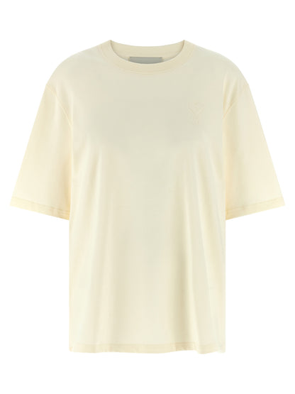 T-Shirt by Ami Paris for women in cotton beige showcases a chic silhouette, artfully detailed with a chic crew neckline and short-sleeve for a chic finish.