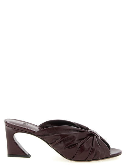Platform Slider Sandals by Fendi for women in nappa lamb leather bordeaux, gold & signature showcases a sculptural silhouette as Women's Nappa Lamb Leather Platform Slider Sandals, defined by a sculptural platform and sculptural almond toe style for a sculptural look.