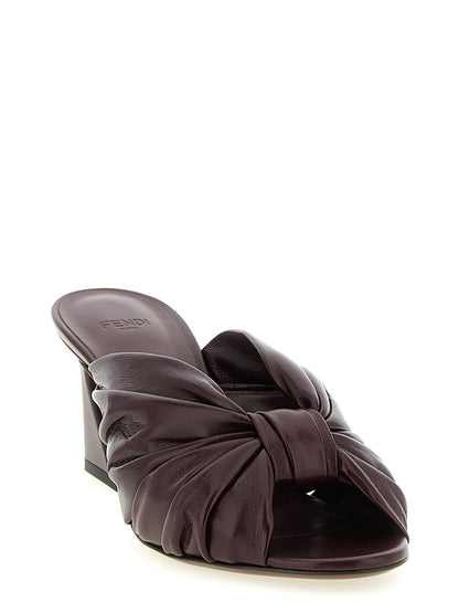 Platform Slider Sandals by Fendi for women in nappa lamb leather bordeaux, gold & signature features an effortlessly chic silhouette from the Women's Nappa Lamb Leather Platform Slider Sandals collection, showcasing a effortlessly chic platform and elegant almond toe style.