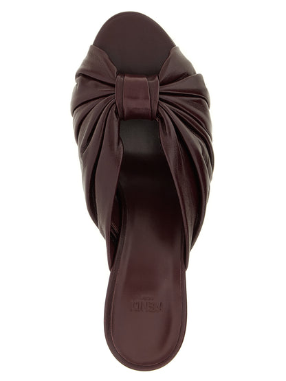 Platform Slider Sandals by Fendi for women in nappa lamb leather bordeaux, gold & signature features an exquisite silhouette, showcasing the exquisite Women's Nappa Lamb Leather Platform Slider Sandals with a platform and almond toe style.