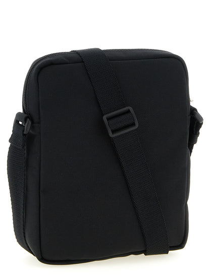 Crossbody Messenger Bag by Balenciaga for men in nylon & polyester black features a statement-making Explorer Nylon & Polyester Crossbody Messenger Bag design with a secure zipper, statement-making , and versatile crossbody-strap, shoulder-strap & adjustable-strap for a sophisticated look.