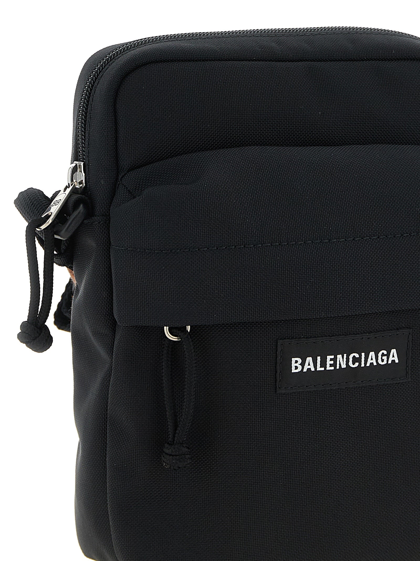This Crossbody Messenger Bag by Balenciaga for men in nylon & polyester black presents a versatile silhouette from the Explorer Nylon & Polyester Crossbody Messenger Bag collection, featuring a secure zipper, ample , and versatile crossbody-strap, shoulder-strap & adjustable-strap.