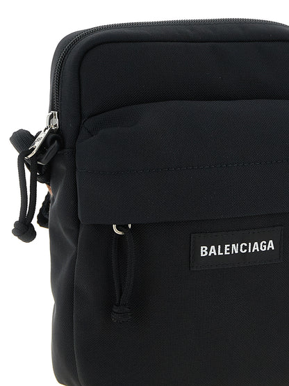 This Crossbody Messenger Bag by Balenciaga for men in nylon & polyester black presents a versatile silhouette from the Explorer Nylon & Polyester Crossbody Messenger Bag collection, featuring a secure zipper, ample , and versatile crossbody-strap, shoulder-strap & adjustable-strap.