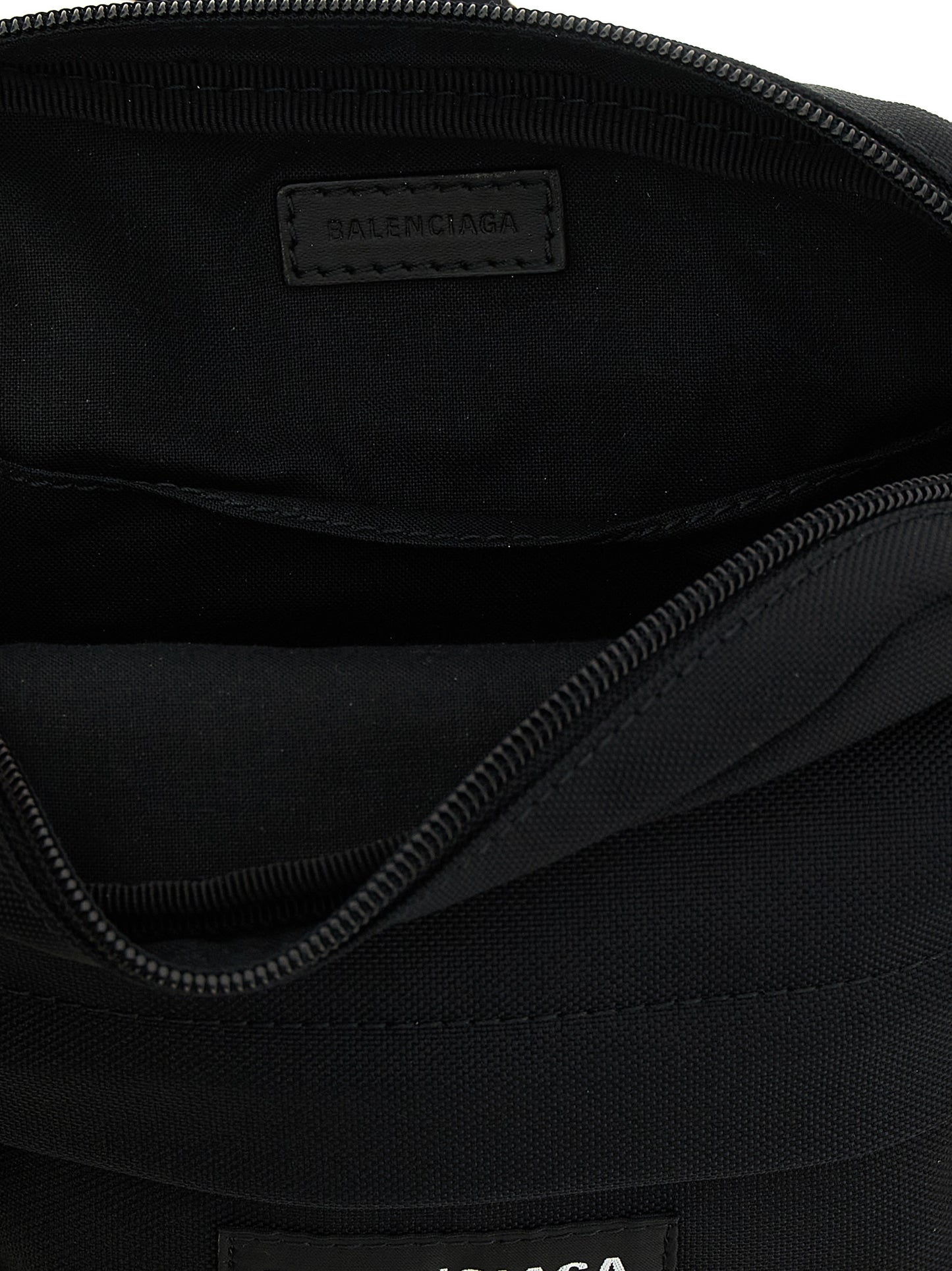 Crossbody Messenger Bag by Balenciaga for men in nylon & polyester black showcases a stylish Explorer Nylon & Polyester Crossbody Messenger Bag design, featuring a secure zipper and ample with versatile crossbody-strap, shoulder-strap & adjustable-strap for a stylish look.