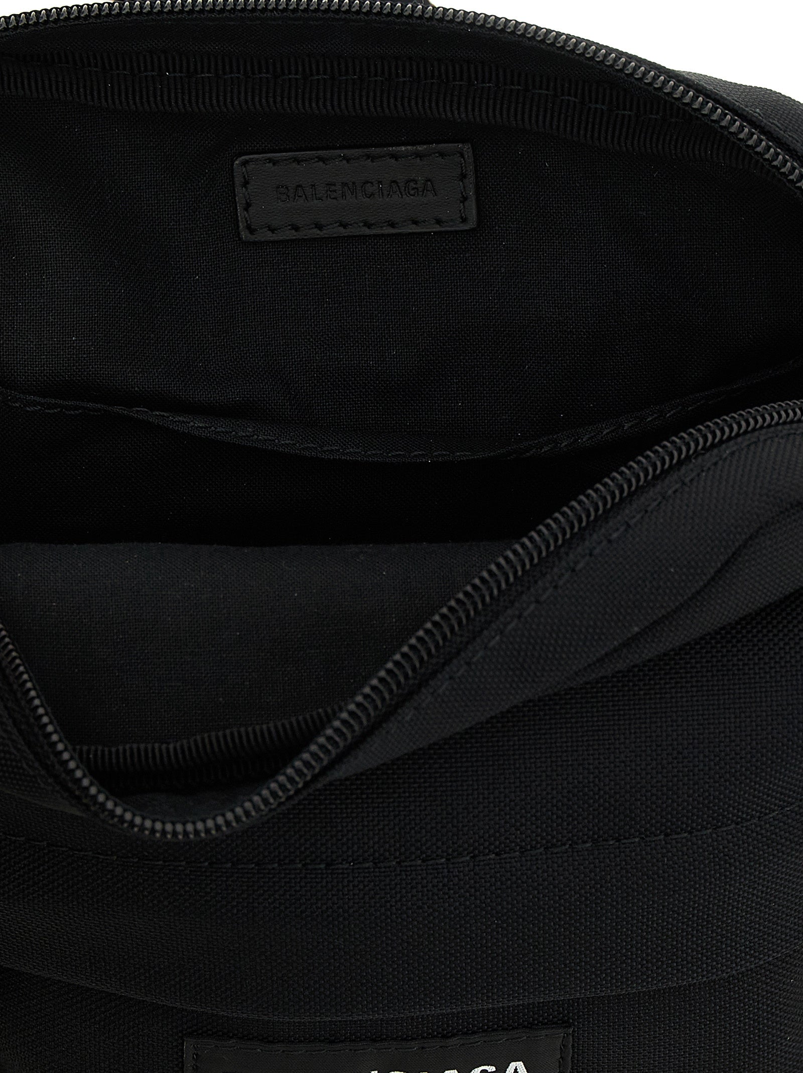 Crossbody Messenger Bag by Balenciaga for men in nylon & polyester black showcases a stylish Explorer Nylon & Polyester Crossbody Messenger Bag design, featuring a secure zipper and ample with versatile crossbody-strap, shoulder-strap & adjustable-strap for a stylish look.