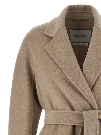 Trench Coat by Max Mara for women in cashmere beige features an dramatic silhouette, perfectly showcasing the elegant lapel neckline and sophisticated pockets for a truly dramatic aesthetic.