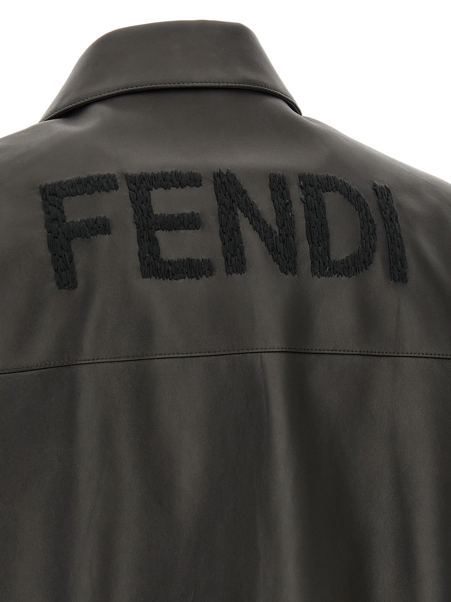 Jacket by Fendi for men in lamb leather black presents a impeccable silhouette, showcasing distinct pockets and a impeccable for a sophisticated finish.