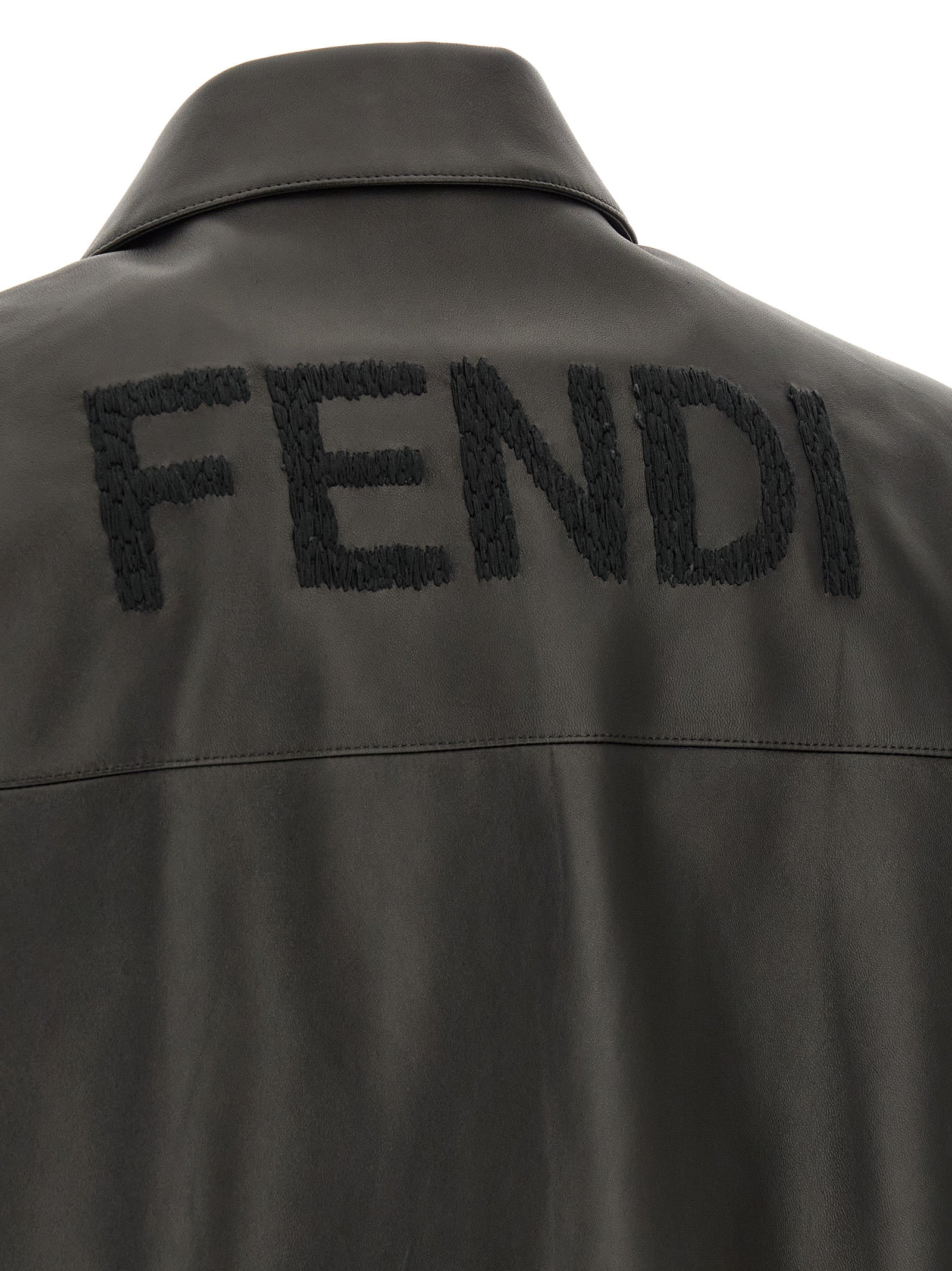 Jacket by Fendi for men in lamb leather black presents a impeccable silhouette, showcasing distinct pockets and a impeccable for a sophisticated finish.
