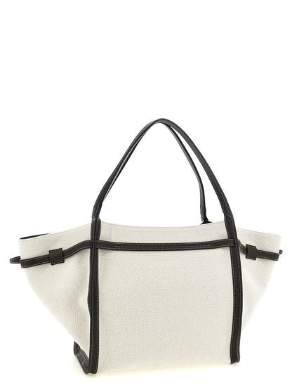 Medium Shopper Tote Bag by Tod's for women in linen canvas & calfskin leather multicolor features a distinguished T Timeless Tim Linen Canvas & Calfskin Leather Medium Shopper Tote Bag design, complete with a secure hook, ample , and versatile adjustable-strap & handle for a distinguished look.