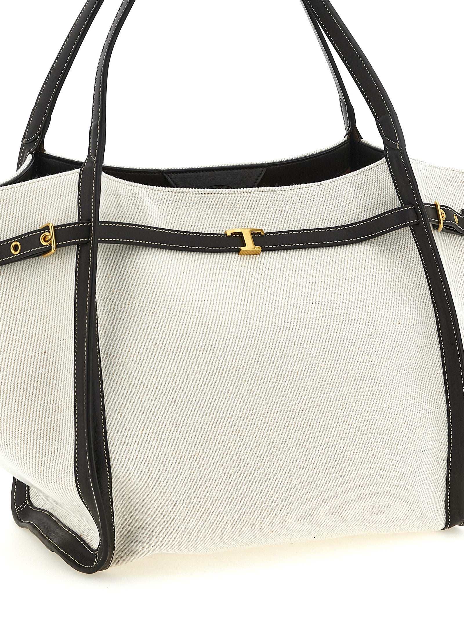 Medium Shopper Tote Bag by Tod's for women in linen canvas & calfskin leather multicolor features a distinguished T Timeless Tim Linen Canvas & Calfskin Leather Medium Shopper Tote Bag design, complete with a secure hook, ample , and versatile adjustable-strap & handle for a distinguished look.