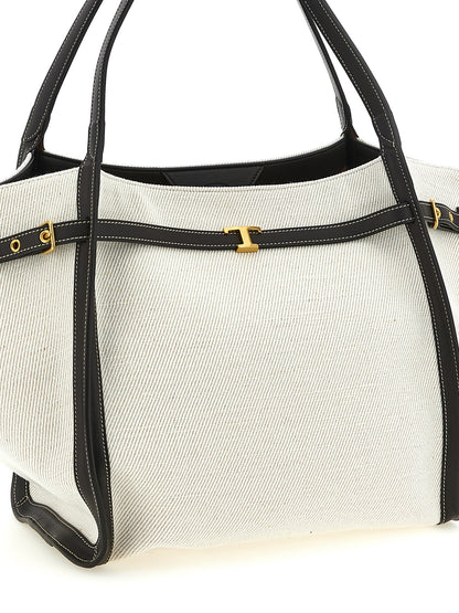 Medium Shopper Tote Bag by Tod's for women in linen canvas & calfskin leather multicolor features a distinguished T Timeless Tim Linen Canvas & Calfskin Leather Medium Shopper Tote Bag design, complete with a secure hook, ample , and versatile adjustable-strap & handle for a distinguished look.