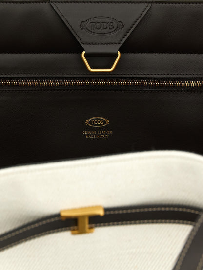 This Medium Shopper Tote Bag by Tod's for women in linen canvas & calfskin leather multicolor features an on trend T Timeless Tim Linen Canvas & Calfskin Leather Medium Shopper Tote Bag design with a secure hook, ample , and on trend adjustable-strap & handle.