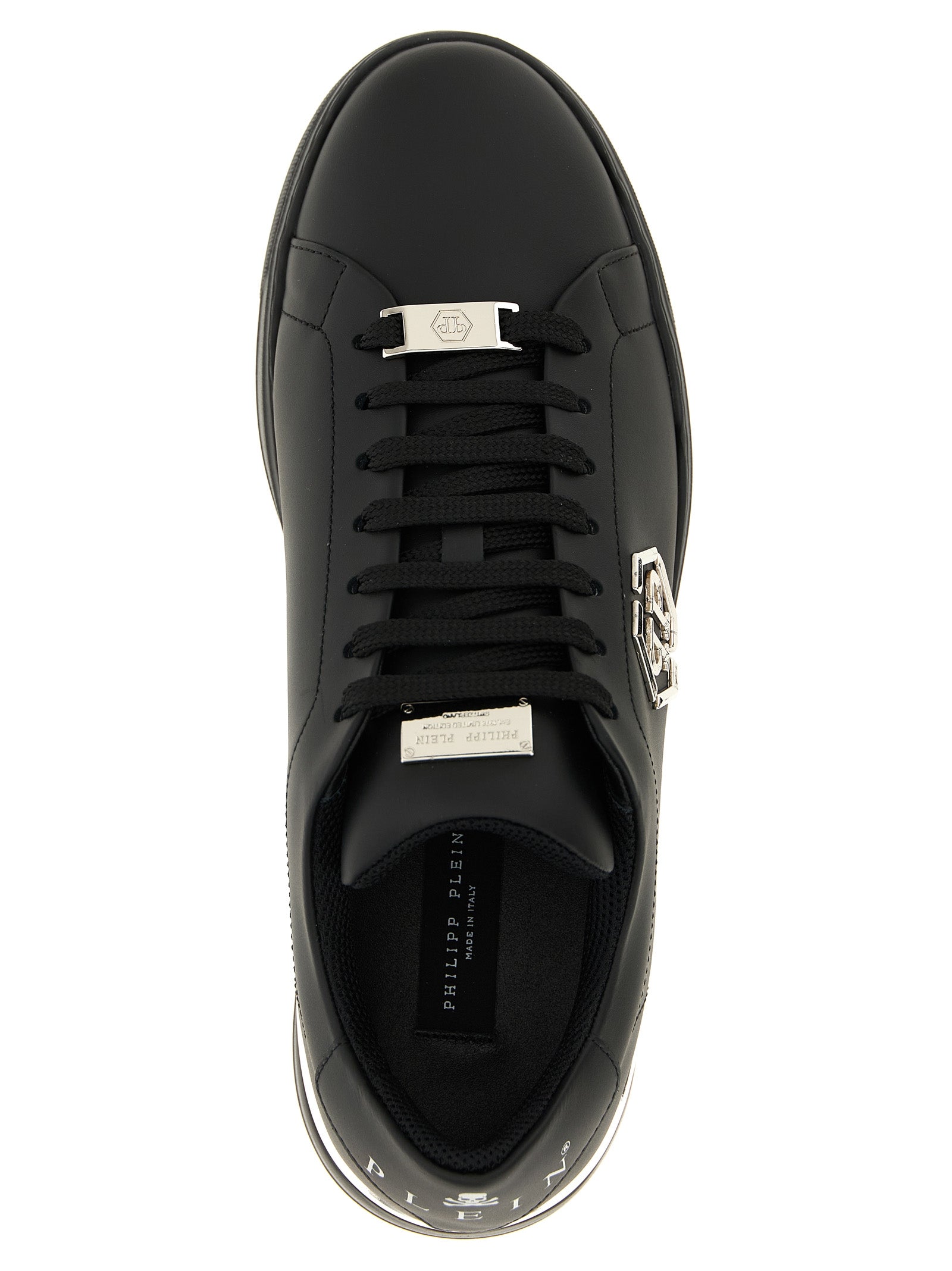 Sneakers by Philipp Plein for men in calfskin leather black & print presents a on trend silhouette from the Men's Low Top Calfskin Leather Sneakers collection, showcasing a on trend low-top style for an elevated aesthetic.