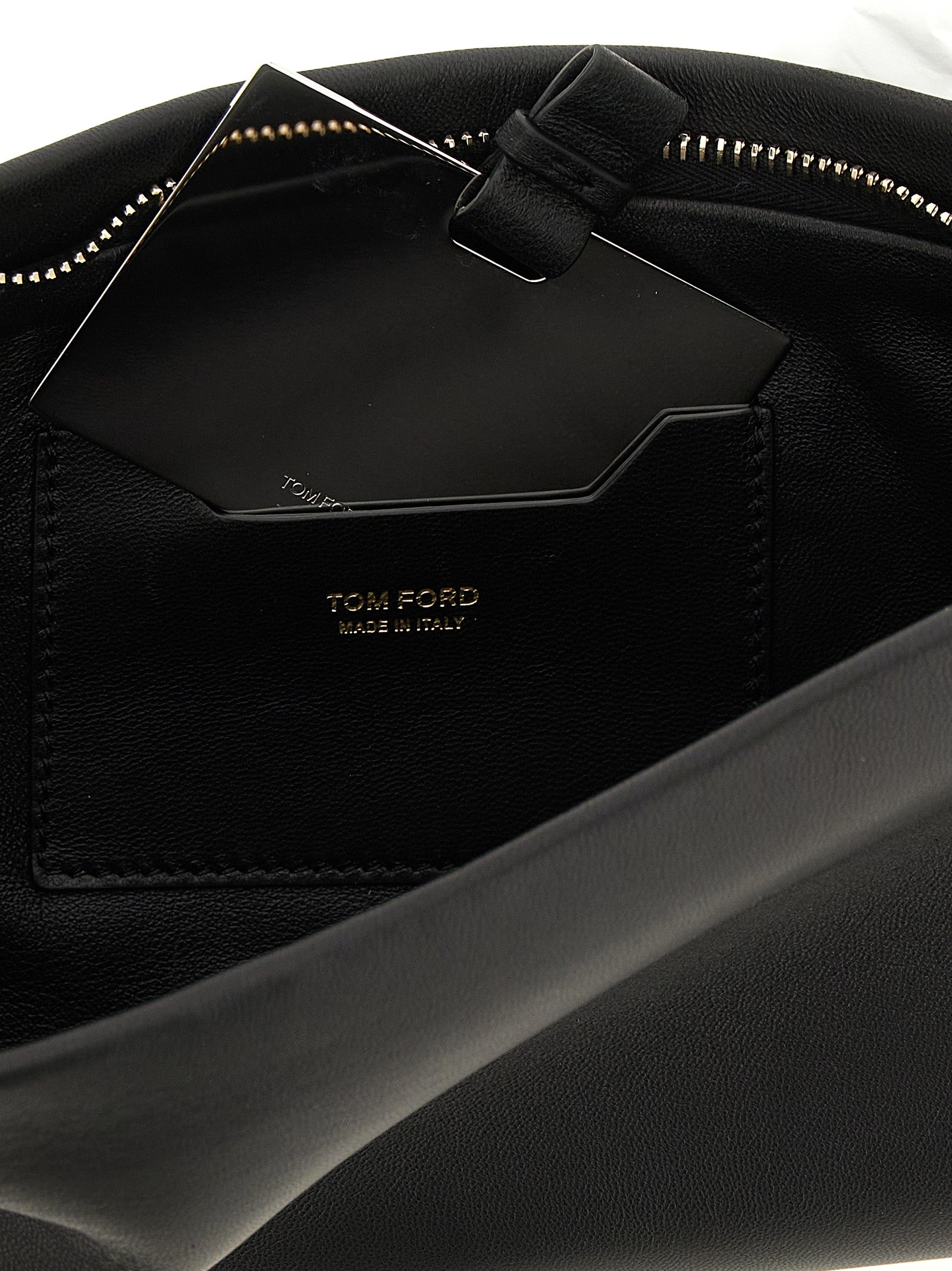 Evening Clutch Handbag by Tom Ford for women in lamb leather black & gold features a sculptural silhouette with a secure zipper, ample , and versatile for a sculptural finish.