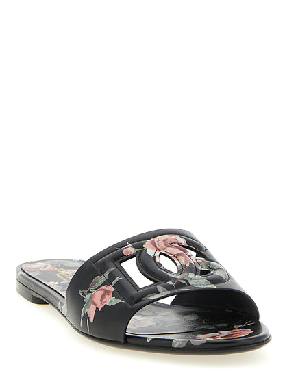 Sliders Flat Shoes by Dolce & Gabbana for women in calfskin leather black, rose & print features an captivating silhouette, showcasing the captivating style of the Women's Calfskin Leather Sliders Flat Shoes with its distinct and refined .