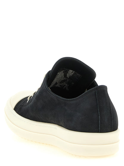Sneakers by Rick Owens for women in bos taurus calfskin leather black presents a sumptuous silhouette, artfully capturing the essence of the Women's Low Top Bos Taurus Calfskin Leather Sneakers with its sumptuous low-top style design.