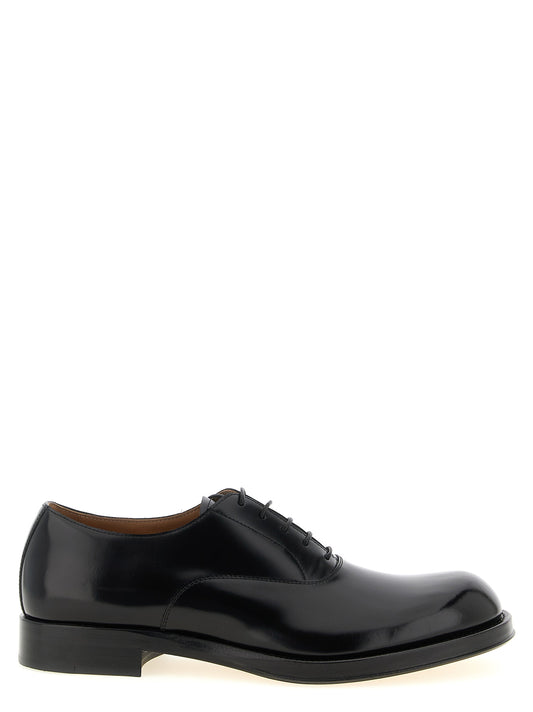 Derby Lace-Up Shoes by Dries Van Noten for men in calfskin leather black showcases a timeless silhouette from the Men's Calfskin Leather Derby Lace-Up Shoes collection, featuring a timeless and for a timeless finish.