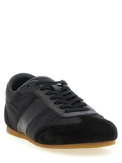 Athletic Sneakers by Lemaire for women in polyamide suede leather black features an exquisite silhouette, showcasing the premium athletic style of the Women's Athletic Polyamide Suede Leather Sneakers with an exquisite finish.