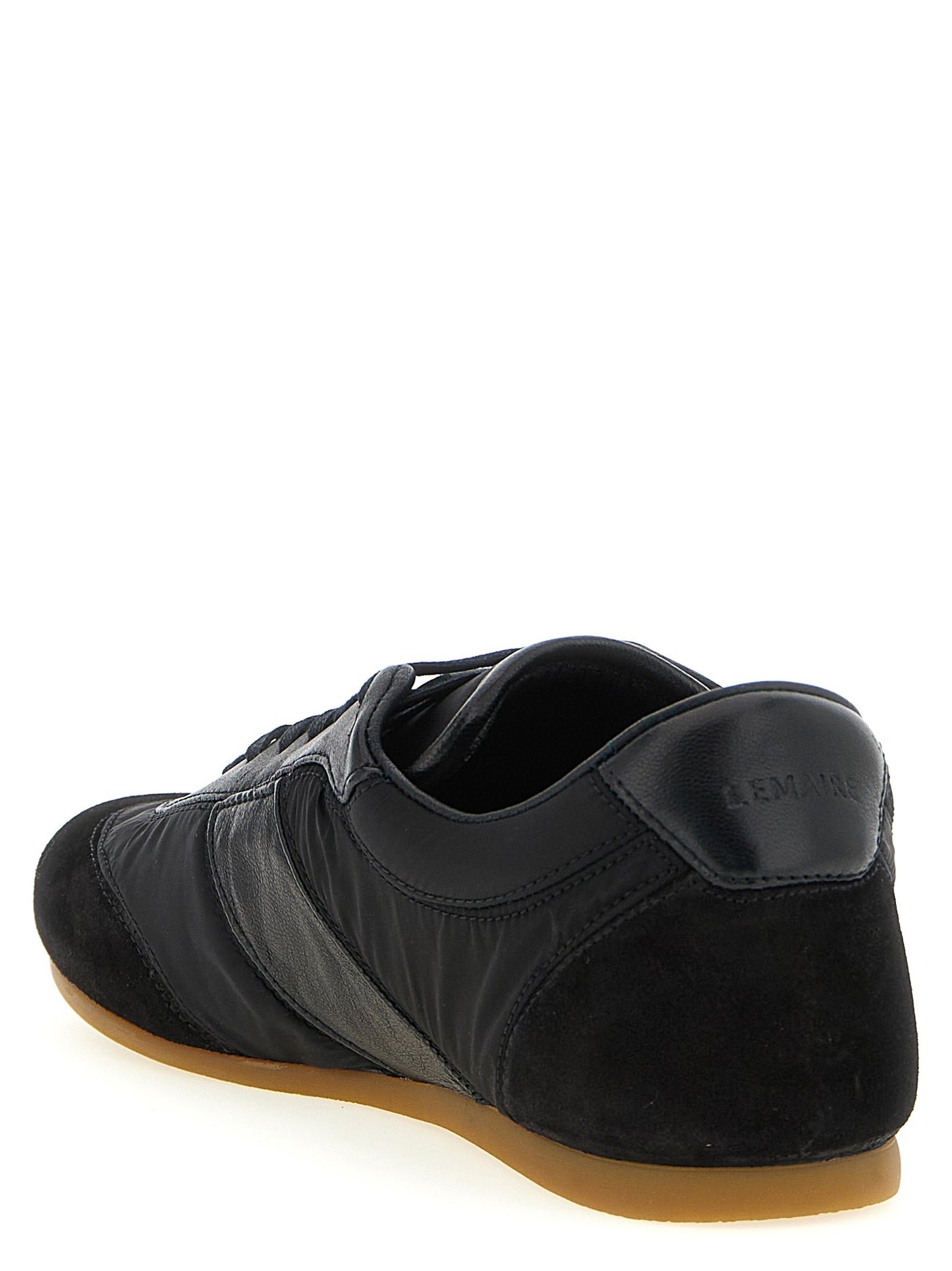 Athletic Sneakers by Lemaire for women in polyamide suede leather black showcases a architectural silhouette, artfully capturing the essence of the Women's Athletic Polyamide Suede Leather Sneakers with its signature architectural athletic style construction.