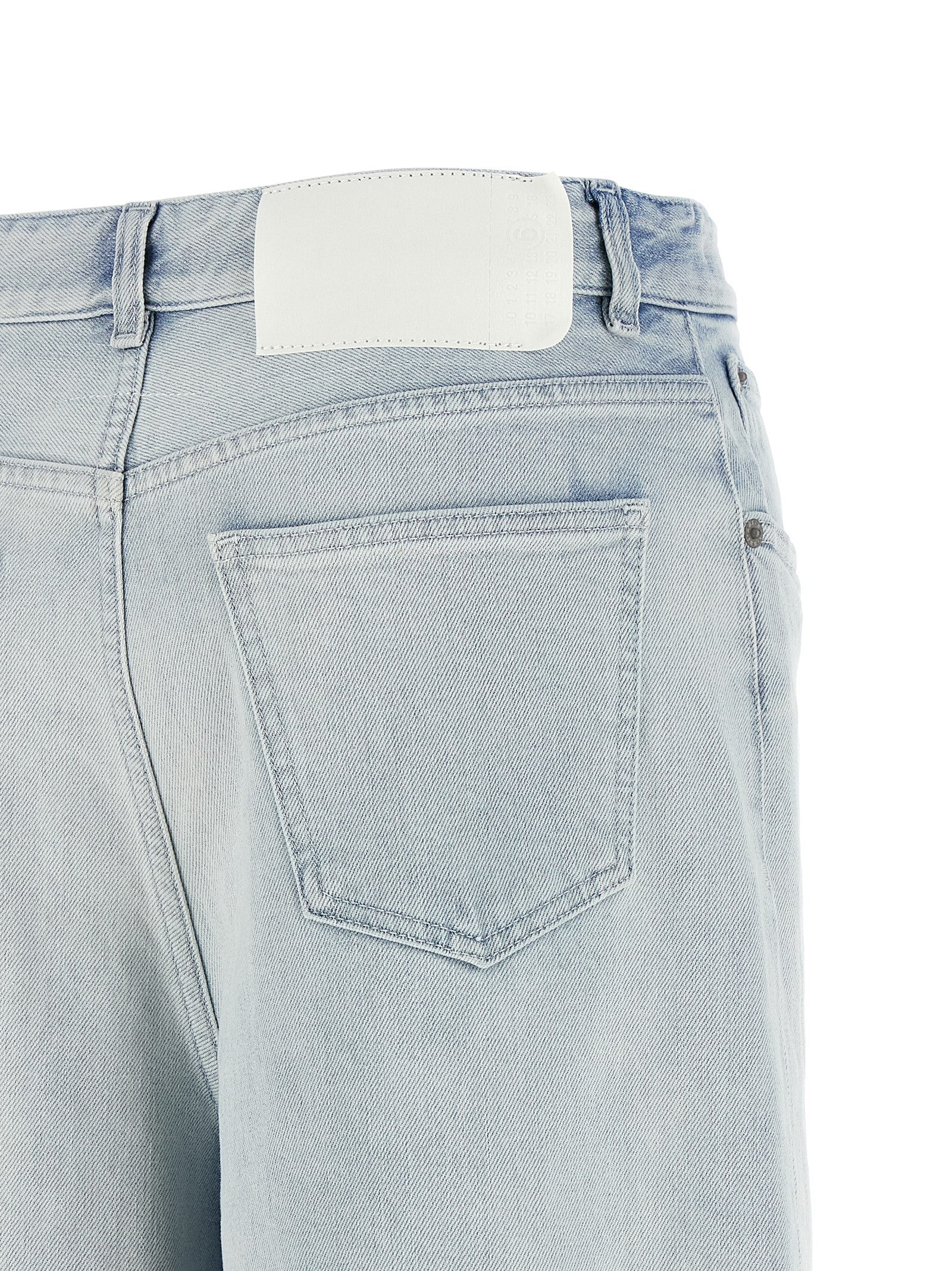 Jeans by MM6 Maison Margiela for women in stretch denim cotton light-blue, white & signature presents a refined pantology silhouette, artfully defined by a refined pantology straight-leg & relaxed-fit, long, and a sophisticated .