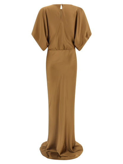 Dress by Norma Kamali for women in polyester satin beige features a dramatic silhouette, showcasing an elegant crew neckline and that flows into a dramatic short long.