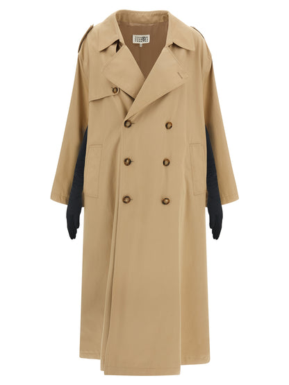 Trench Coat by MM6 Maison Margiela for women in stretch cotton beige features an dramatic silhouette, perfectly showcasing the elegant lapel neckline and sophisticated pockets for a truly dramatic aesthetic.