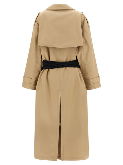 Trench Coat by MM6 Maison Margiela for women in stretch cotton and beige presents a exquisite silhouette, showcasing a exquisite lapel neckline and functional pockets for an elevated aesthetic.