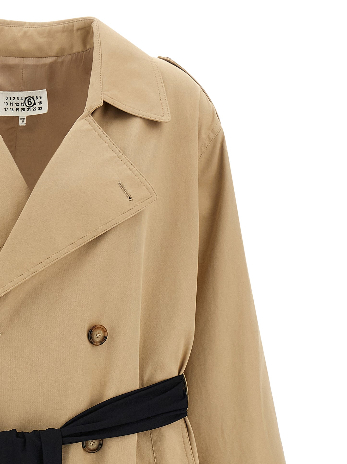Trench Coat by MM6 Maison Margiela for women in stretch cotton beige showcases a contemporary silhouette, detailed with a contemporary lapel neckline and distinctive pockets for a truly contemporary finish.