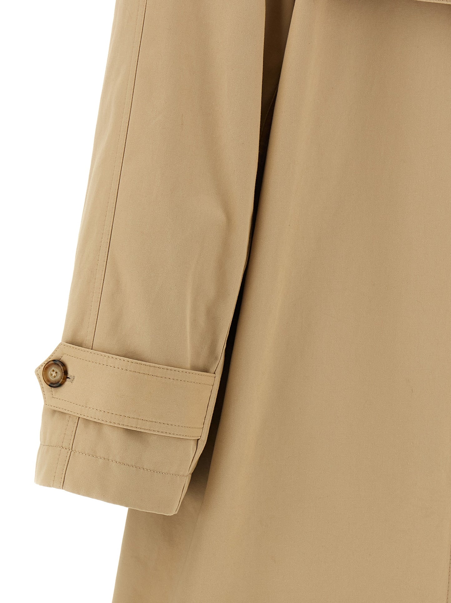 Trench Coat by MM6 Maison Margiela for women in stretch cotton beige presents a distinguished silhouette, artfully detailed with pockets and a distinguished for a sophisticated, distinguished finish.