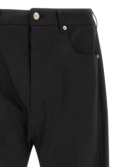 Jeans by Rick Owens for men in denim & virgin wool black features a polished silhouette with a polished wide, reaching a polished long and finished with a polished low rise.