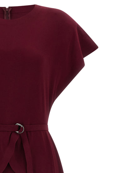 Dress by Norma Kamali for women in stretch polyester bordeaux features a dramatic silhouette, showcasing an elegant crew neckline and that flows into a dramatic midi short.