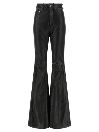Trousers by Rick Owens for women in lamb leather black presents a perennial silhouette, meticulously tailored with a bootcut & slim cut, long finish, and an elegant high rise.