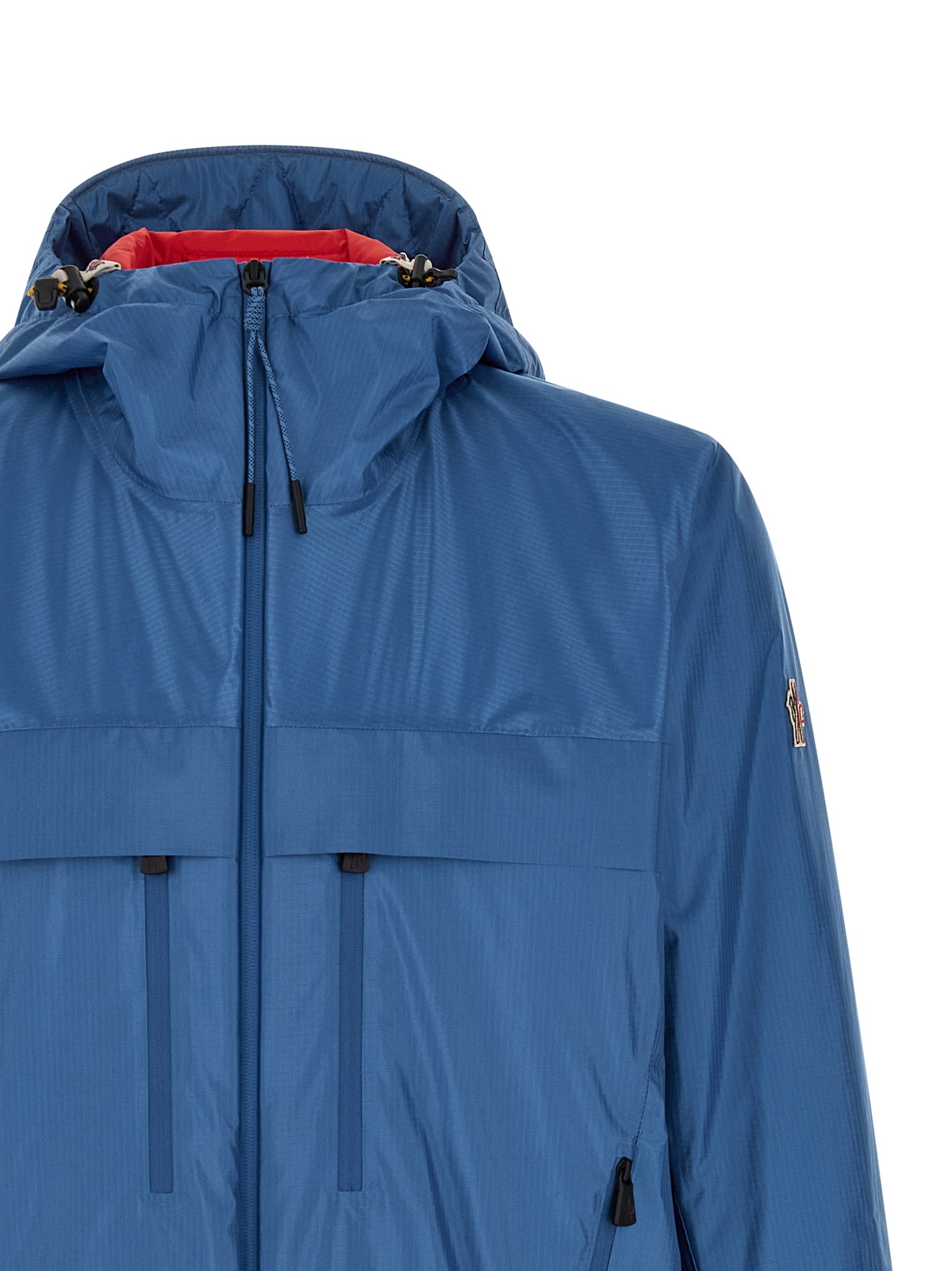 Hooded Windbreaker Jacket by Moncler Grenoble for men in polyamide & polyester blue showcases a modern silhouette, integrating hooded, insulated & windproof and a modern hooded neckline for a sophisticated finish.