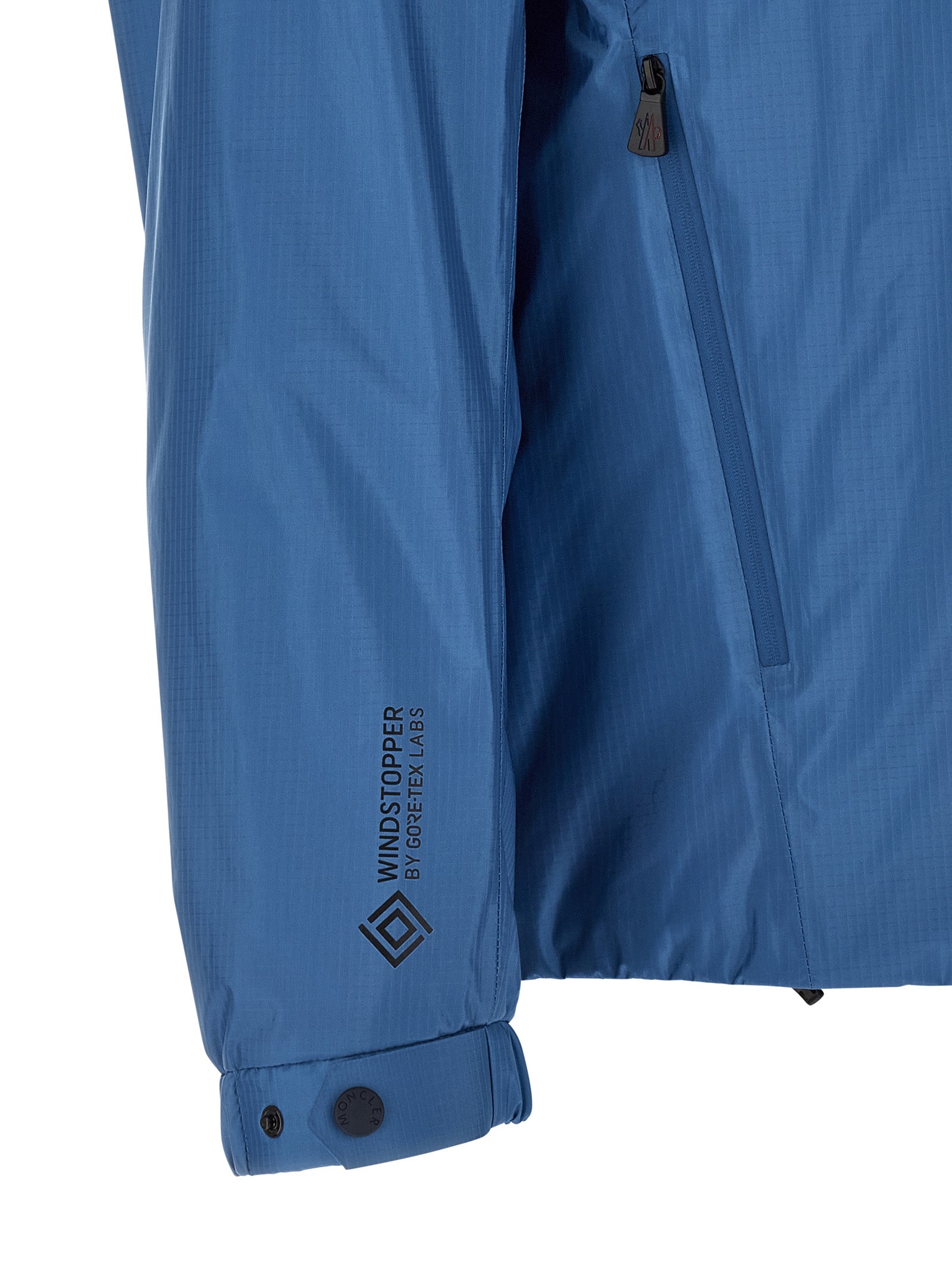 Hooded Windbreaker Jacket by Moncler Grenoble for men in polyamide & polyester blue showcases a urban chic silhouette, detailed with a urban chic hooded neckline and functional hooded, insulated & windproof for a polished finish.