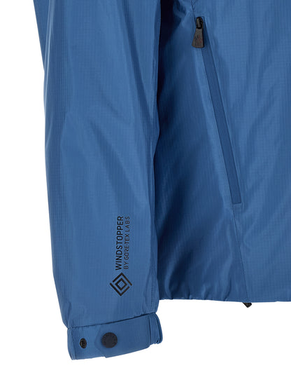 Hooded Windbreaker Jacket by Moncler Grenoble for men in polyamide & polyester blue showcases a urban chic silhouette, detailed with a urban chic hooded neckline and functional hooded, insulated & windproof for a polished finish.