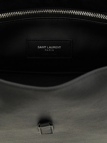 Micro Shoulder Clutch Bag by Saint Laurent for women in suede calfskin leather black presents a versatile silhouette, showcasing a secure and versatile with versatile shoulder-strap, adjustable-strap & handle for a sophisticated look.