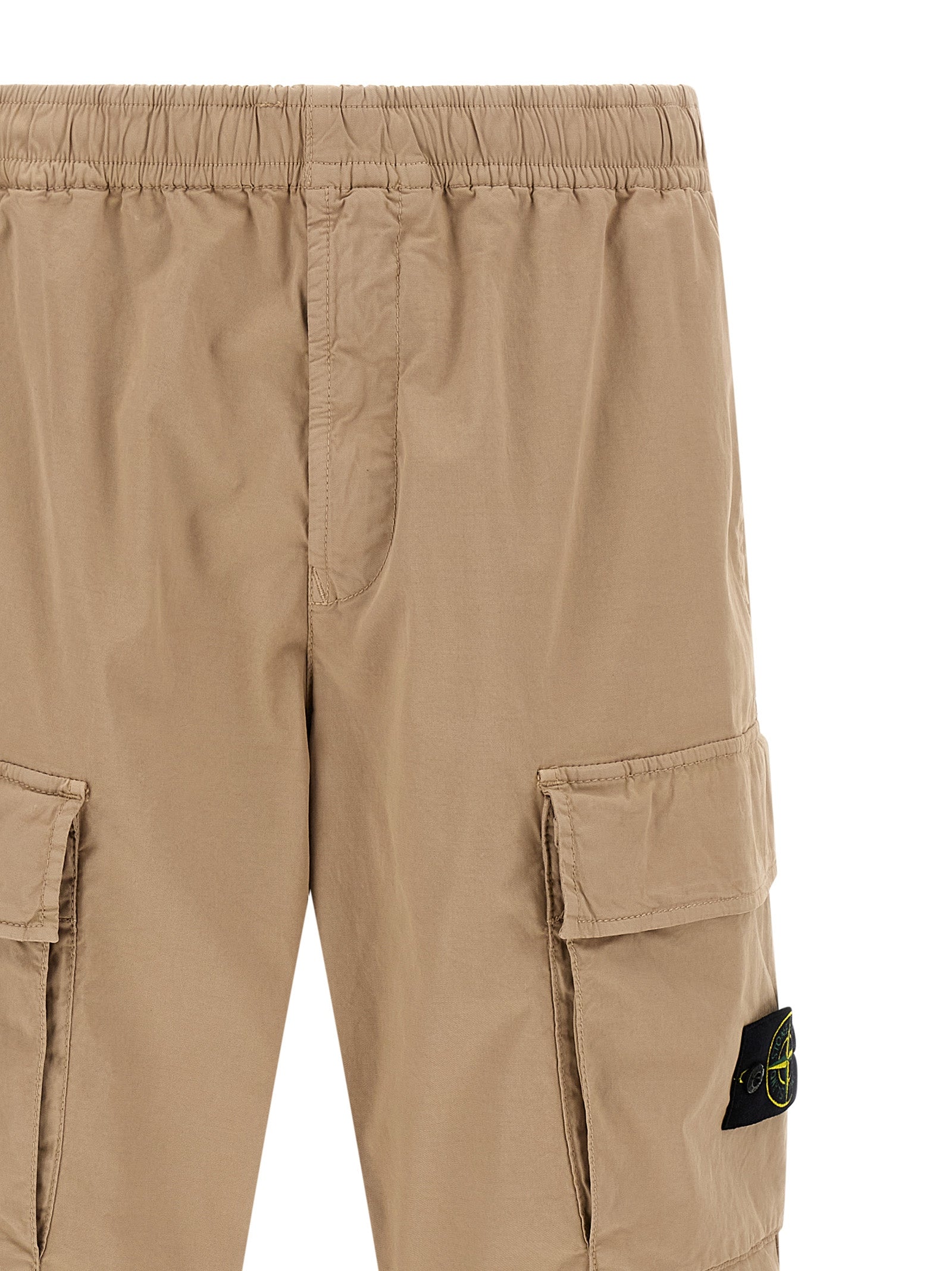 Cargo Pants by Stone Island for men in stretch organic cotton twill beige & signature features an smart casual and long, expertly tailored with a and smart casual utilitarian details for a sophisticated look.