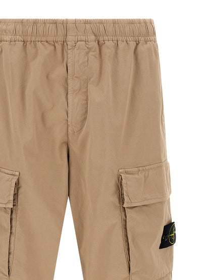 Cargo Pants by Stone Island for men in stretch organic cotton twill beige & signature features an smart casual and long, expertly tailored with a and smart casual utilitarian details for a sophisticated look.